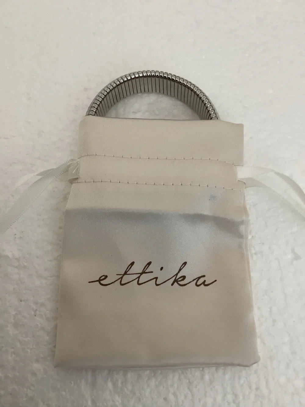 This Ettika silver-plated flexible tubogas-style stretch cuff silver tone brace